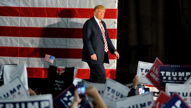 Donald Trump walks to the podium at the start of a campaign rally in Colorado Springs, Colo., on Oct. 18, 2016.