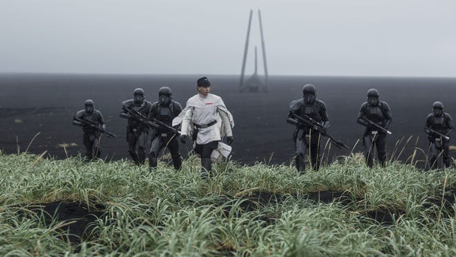 Orson Krennic (center, Ben Mendelsohn) takes his Death Troopers on a mission in 'Rogue One: A Star Wars Story.'