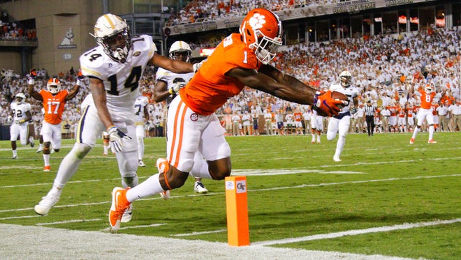 Clemson wide receiver Trevion Thompson (1) tries to score before stepping out of bounds against Georgia Tech.