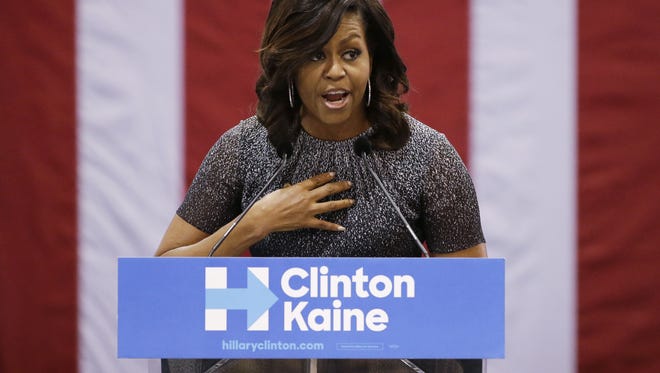 First lady Michelle Obama addresses the Arizona Democratic Party Early Vote rally at the Phoenix Convention Center on Thursday, Oct. 20, 2016, in Phoenix.  Michelle Obama is campaigning for Democratic presidential nominee Hillary Clinton.