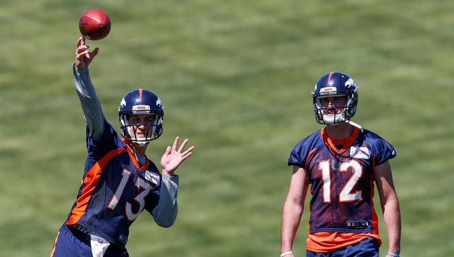 Broncos quarterback Trevor Siemian (13) throws a pass during minicamp at UCHealth Training Center in Englewood, Colo.