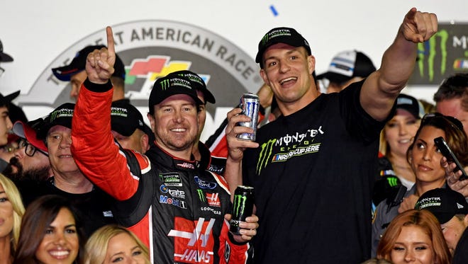 NASCAR Cup Series driver Kurt Busch (41) celebrates with New England Patriots tight end Rob Gronkowski after winning the 2017 Daytona 500.
