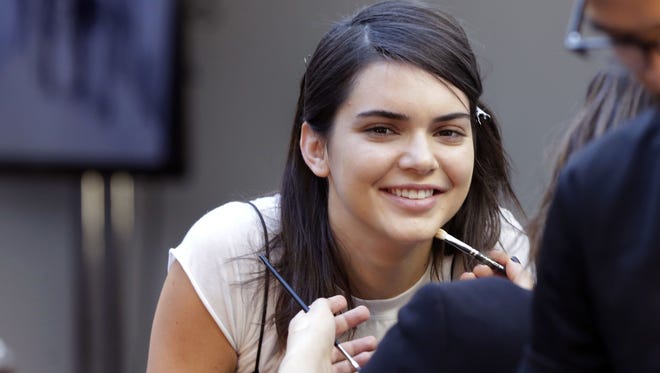 Model Kendall Jenner's Pepsi ad is being taken off the air. Here she is getting makeup for a modeling session.