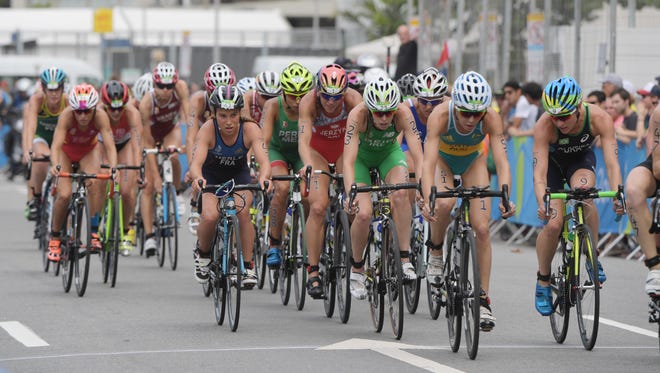 The lead pack rides during the cycling portion during the women's triathlon during the Rio 2016 Summer Olympic Games at Fort Copacabana.