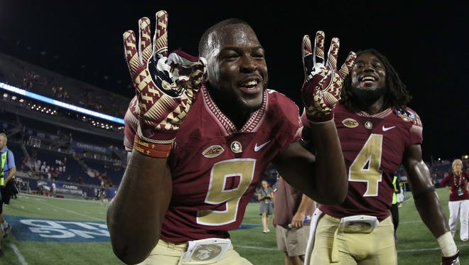 Florida State running backs Jacques Patrick (9) and Dalvin Cook (4) celebrate after beating Ole Miss in the season opener.