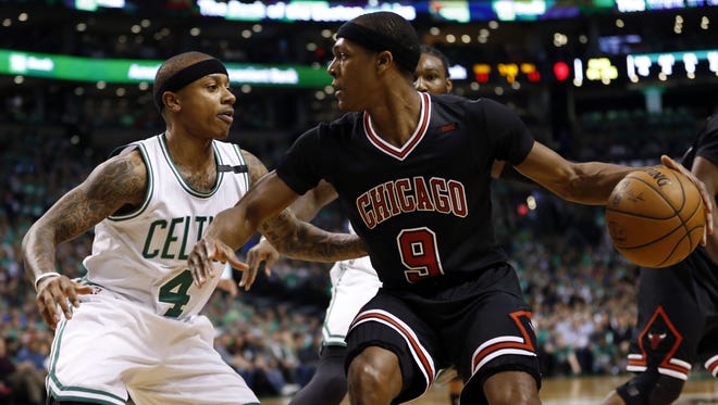 Chicago Bulls point guard Rajon Rondo (9) is guarded by Boston Celtics point guard Isaiah Thomas (4) during the first quarter in game two of the first round of the 2017 NBA Playoffs at TD Garden.