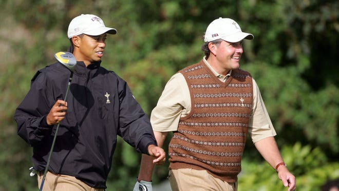 Tiger Woods walks towards the 10th tee with teammate Phil Mickelson during practice before  the 2006 Ryder Cup at The K Club on in Straffan, Co. Kildare, Ireland.