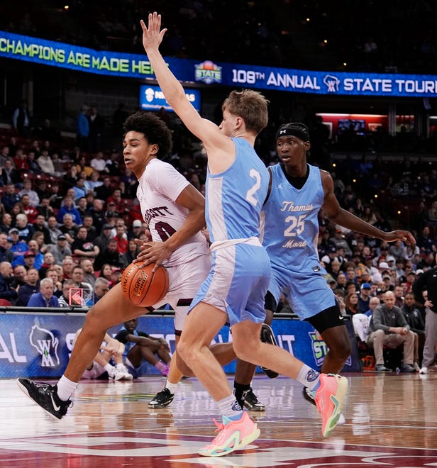 St. Thomas More's Evan Oleson (2) guards Prescott's Kobe Russell (0) during the second half of the WIAA Division 3 boys basketball state semifinal game on Thursday March 14, 2024 at the Kohl Center in Madison, Wis.