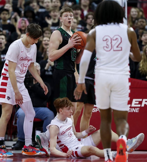 Almond-Bancroft High School's Ayden Phillips (15) reacts to being called for a foul against Abundant Life Christian School's Jacob Koon (2) in a Division 5 semifinal game during the WIAA state boys basketball tournament on Friday, March 15, 2024 at the Kohl Center in Madison, Wis. Abundant Life Christian won the game, 42-37.