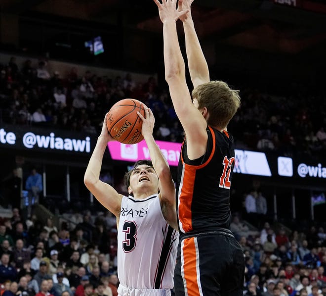 West Salem's Landon Michlig (12) attempts to block Pewaukee's Karson Osterman (3) during the first half of the WIAA Division 2 boys basketball state semifinal game on Friday March 15, 2024 at the Kohl Center in Madison, Wis.