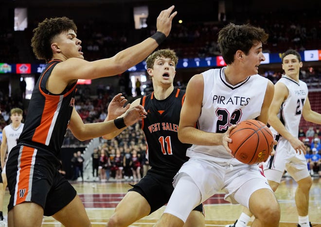 West Salem's Tamarrein Henderson (1) and West Salem's Carter Pontius (11) guard Pewaukee's Luka Momcilovic (23) during the first half of the WIAA Division 2 boys basketball state semifinal game on Friday March 15, 2024 at the Kohl Center in Madison, Wis.