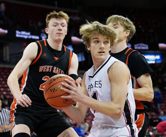 West Salem's Hutson Hendrickson (20) and Alex Clements (23) guard Pewaukee's Jake Jordan (11) during the second half of the WIAA Division 2 boys basketball state semifinal game on Friday March 15, 2024 at the Kohl Center in Madison, Wis.