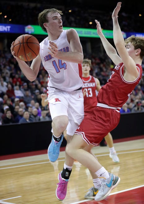 Arrowhead High School's Bennett Basich (14) against Neenah High School's Charlie Wunderlich (23) in a Division 1 semifinal game during the WIAA state boys basketball tournament on Friday, March 15, 2024 at the Kohl Center in Madison, Wis. Arrowhead defeated Neenah for 99-95 in four overtimes.
Wm. Glasheen USA TODAY NETWORK-Wisconsin