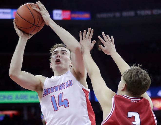 Arrowhead High School's Bennett Basich (14) against Neenah High School's Justin Janssen (3) in a Division 1 semifinal game during the WIAA state boys basketball tournament on Friday, March 15, 2024 at the Kohl Center in Madison, Wis. Arrowhead defeated Neenah for 99-95 in four overtimes.
Wm. Glasheen USA TODAY NETWORK-Wisconsin