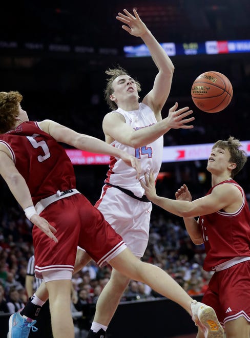 Arrowhead High School's Bennett Basich (14) against Neenah High School's Luke Jung (5) and Grant Dean (13) in a Division 1 semifinal game during the WIAA state boys basketball tournament on Friday, March 15, 2024 at the Kohl Center in Madison, Wis. Arrowhead defeated Neenah for 99-95 in four overtimes.
Wm. Glasheen USA TODAY NETWORK-Wisconsin
