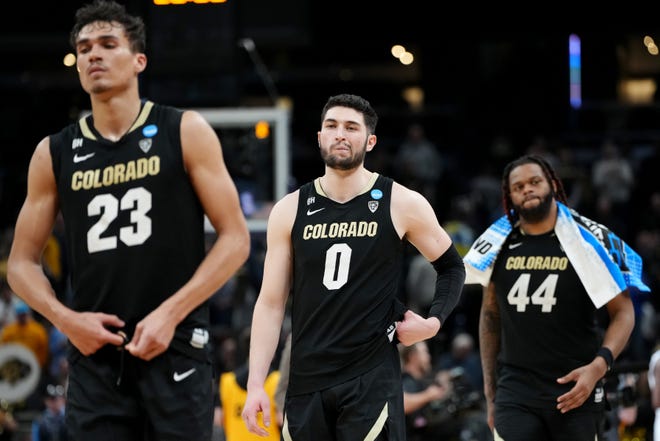 Tristan da Silva #23, Luke O'Brien #0 and Eddie Lampkin Jr. #44 of the Colorado Buffaloes walk off the court after being defeated by the Marquette Golden Eagles in the second round of the NCAA Men's Basketball Tournament at Gainbridge Fieldhouse on March 24, 2024 in Indianapolis, Indiana.