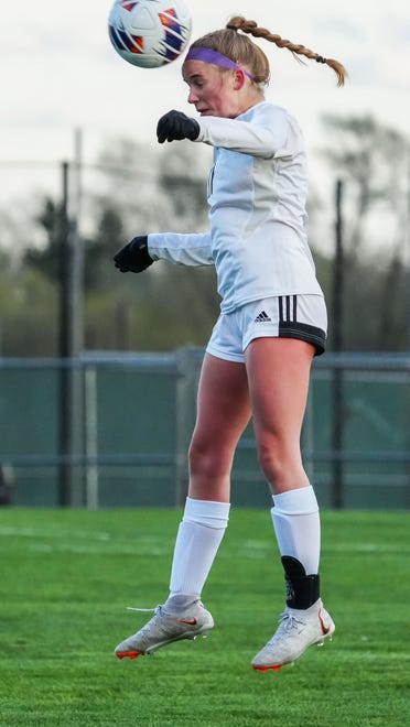 Waunakee's Ava Nielsen (11) elevates for a header during the match at Muskego, Friday, April 19, 2024.