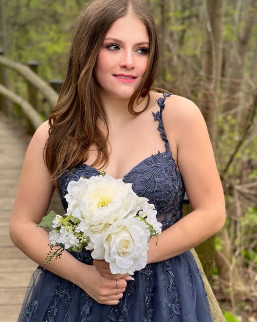 Muskego High School junior Abby Leto finds a nice nature backdrop for her prom photos before heading to the dance at the Brookfield Conference Center on Saturday, April 20, 2024.