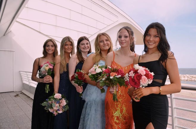 Arrowhead High School students (from left) Kylie Peterson, Kate Ahearn, Johanna Wimmer, Cali Rauch, Bella Boray and Kylie Adams pose for a prom photo on Saturday, April 27, 2024, by the Milwaukee Art Museum.